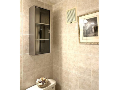 RENOVATED FRESH PAINT EXPANSIVE WATER VIEW WALK TO HOUSES OF on Hillsboro Pines Golf in Florida - for sale on GolfHomes.com, golf home, golf lot