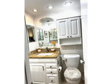 RENOVATED FRESH PAINT EXPANSIVE WATER VIEW WALK TO HOUSES OF on Hillsboro Pines Golf in Florida - for sale on GolfHomes.com, golf home, golf lot