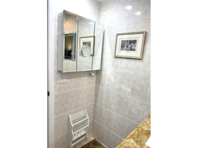 RENOVATED FRESH PAINT EXPANSIVE WATER VIEW WALK TO HOUSES OF on Hillsboro Pines Golf in Florida - for sale on GolfHomes.com, golf home, golf lot