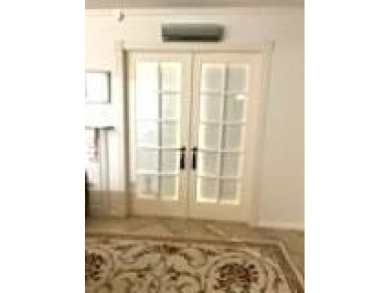 RENOVATED FRESH PAINT EXPANSIVE WATER VIEW WALK TO HOUSES OF on Hillsboro Pines Golf in Florida - for sale on GolfHomes.com, golf home, golf lot