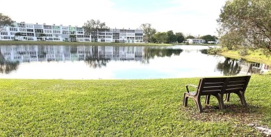 RENOVATED FRESH PAINT EXPANSIVE WATER VIEW WALK TO HOUSES OF on Hillsboro Pines Golf in Florida - for sale on GolfHomes.com, golf home, golf lot