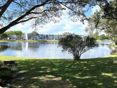 RENOVATED FRESH PAINT EXPANSIVE WATER VIEW WALK TO HOUSES OF on Hillsboro Pines Golf in Florida - for sale on GolfHomes.com, golf home, golf lot