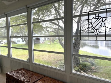 RENOVATED FRESH PAINT EXPANSIVE WATER VIEW WALK TO HOUSES OF on Hillsboro Pines Golf in Florida - for sale on GolfHomes.com, golf home, golf lot