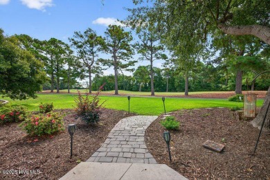 Elegance meets ease with coastal living on the golf course! This on North Shore Country Club in North Carolina - for sale on GolfHomes.com, golf home, golf lot