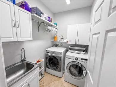 Welcome Home! This spectacular residence, boasting a lake and on Weston Hills Country Club in Florida - for sale on GolfHomes.com, golf home, golf lot