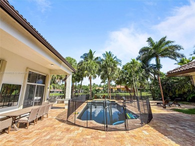 Welcome Home! This spectacular residence, boasting a lake and on Weston Hills Country Club in Florida - for sale on GolfHomes.com, golf home, golf lot