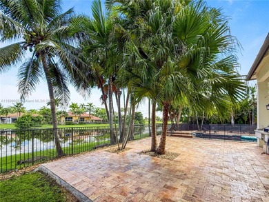 Welcome Home! This spectacular residence, boasting a lake and on Weston Hills Country Club in Florida - for sale on GolfHomes.com, golf home, golf lot