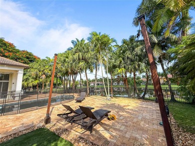 Welcome Home! This spectacular residence, boasting a lake and on Weston Hills Country Club in Florida - for sale on GolfHomes.com, golf home, golf lot