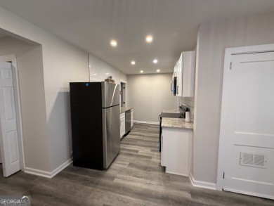 Discover modern comfort in this beautifully renovated home on John A. White Golf Course in Georgia - for sale on GolfHomes.com, golf home, golf lot