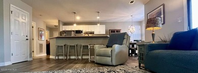 Welcome to this 2nd floor condo in the Oyster Bay community on Oyster Bay Golf Links in North Carolina - for sale on GolfHomes.com, golf home, golf lot