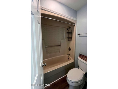 Welcome to this 2nd floor condo in the Oyster Bay community on Oyster Bay Golf Links in North Carolina - for sale on GolfHomes.com, golf home, golf lot