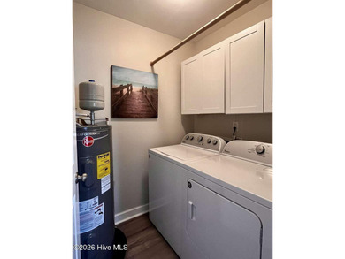 Welcome to this 2nd floor condo in the Oyster Bay community on Oyster Bay Golf Links in North Carolina - for sale on GolfHomes.com, golf home, golf lot