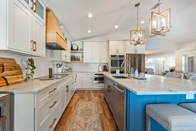 Discover luxury coastal living at its finest in this fully on Apollo Beach Golf and Sea Club in Florida - for sale on GolfHomes.com, golf home, golf lot