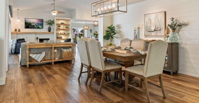 Discover luxury coastal living at its finest in this fully on Apollo Beach Golf and Sea Club in Florida - for sale on GolfHomes.com, golf home, golf lot