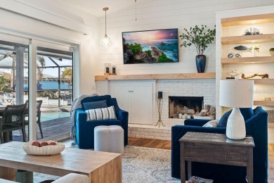 Discover luxury coastal living at its finest in this fully on Apollo Beach Golf and Sea Club in Florida - for sale on GolfHomes.com, golf home, golf lot