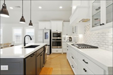 Discover the epitome of lakeside living in this stunning Perry on The Tribute At the Colony in Texas - for sale on GolfHomes.com, golf home, golf lot