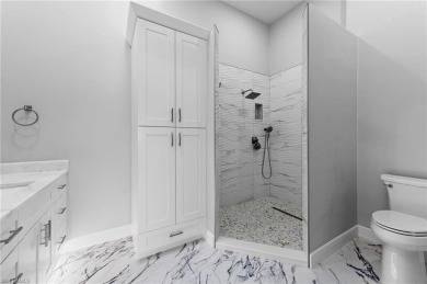 Experience refined Naples living in this beautifully maintained on The Club At Strand in Florida - for sale on GolfHomes.com, golf home, golf lot