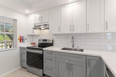 Welcome HOME to this updated corner unit with an open-concept on Palm-Aire Country Club and Resort - The Oaks in Florida - for sale on GolfHomes.com, golf home, golf lot