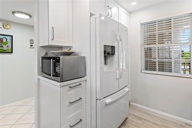 Welcome HOME to this updated corner unit with an open-concept on Palm-Aire Country Club and Resort - The Oaks in Florida - for sale on GolfHomes.com, golf home, golf lot