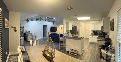 Coastal charm meets comfort in this move-in ready 3-bedroom on Orange Beach Golf Center in Alabama - for sale on GolfHomes.com, golf home, golf lot