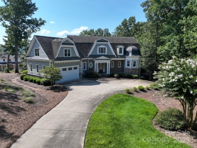 Experience lakefront living at its finest in this stunning on Old North State Club at Uwharrie Point Golf community in North Carolina - for sale on GolfHomes.com, golf home, golf lot