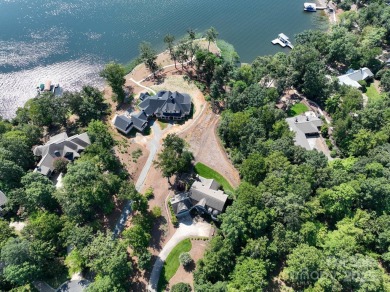 Experience lakefront living at its finest in this stunning on Old North State Club at Uwharrie Point Golf community in North Carolina - for sale on GolfHomes.com, golf home, golf lot