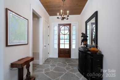 Experience lakefront living at its finest in this stunning on Old North State Club at Uwharrie Point Golf community in North Carolina - for sale on GolfHomes.com, golf home, golf lot
