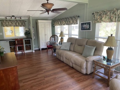 This lovely, manufactured home is in Lake Fairways Country Club on Pine Lakes Country Club in Florida - for sale on GolfHomes.com, golf home, golf lot