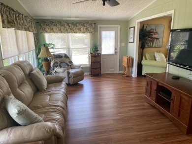 This lovely, manufactured home is in Lake Fairways Country Club on Pine Lakes Country Club in Florida - for sale on GolfHomes.com, golf home, golf lot