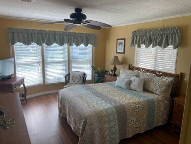 This lovely, manufactured home is in Lake Fairways Country Club on Pine Lakes Country Club in Florida - for sale on GolfHomes.com, golf home, golf lot