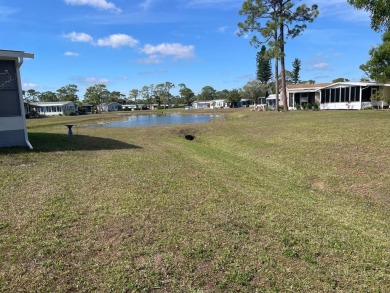 This lovely, manufactured home is in Lake Fairways Country Club on Pine Lakes Country Club in Florida - for sale on GolfHomes.com, golf home, golf lot