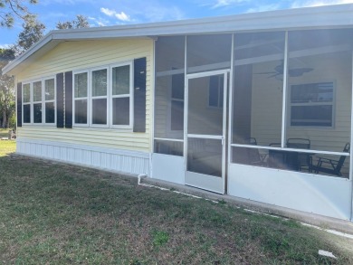 This lovely, manufactured home is in Lake Fairways Country Club on Pine Lakes Country Club in Florida - for sale on GolfHomes.com, golf home, golf lot