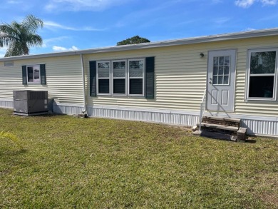 This lovely, manufactured home is in Lake Fairways Country Club on Pine Lakes Country Club in Florida - for sale on GolfHomes.com, golf home, golf lot