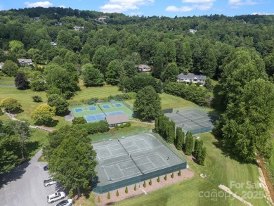 Nestled on 1.2 wooded acres in the gated Kenmure community, this on Kenmure Country Club in North Carolina - for sale on GolfHomes.com, golf home, golf lot