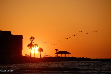 Wake up to breathtaking sunrises and watch dolphins, sea turtles on Ocean Point Golf Links in South Carolina - for sale on GolfHomes.com, golf home, golf lot