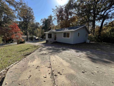 Charming and move-in ready, this beautifully updated 2-bedroom on Cherokee Village North Course in Arkansas - for sale on GolfHomes.com, golf home, golf lot