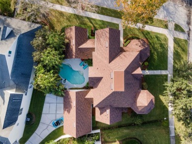 Perched on a large corner lot on coveted Golf Park Drive in Main on Celebration Golf Club in Florida - for sale on GolfHomes.com, golf home, golf lot