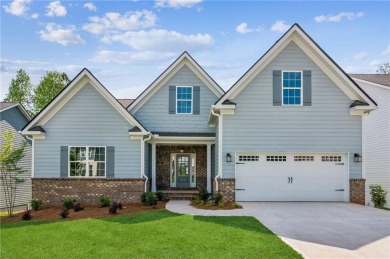 Popular and hard to find Ranch style home on a private homesite on Traditions of Braselton Golf Club in Georgia - for sale on GolfHomes.com, golf home, golf lot