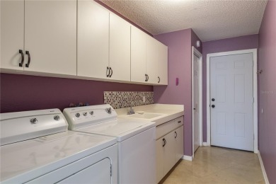 Welcome to this charming two-bedroom, two-bath home with a on Glen Lakes Country Club in Florida - for sale on GolfHomes.com, golf home, golf lot