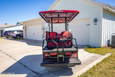 Perfectly located Dreamsicle cottage 2 bedroom/ 2 bath with den on LPGA International Golf Course in Florida - for sale on GolfHomes.com, golf home, golf lot