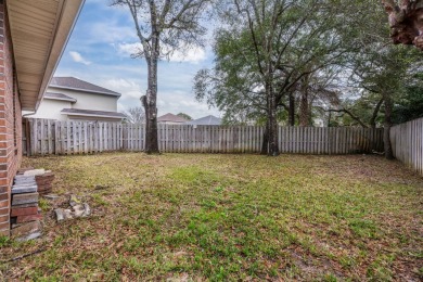 This well-maintained 4-bedroom, 2-bathroom home is located just on Fort Walton Beach Golf Course in Florida - for sale on GolfHomes.com, golf home, golf lot