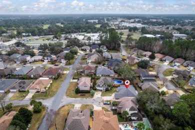 This well-maintained 4-bedroom, 2-bathroom home is located just on Fort Walton Beach Golf Course in Florida - for sale on GolfHomes.com, golf home, golf lot