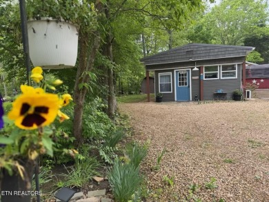 This lovely home on a one and a half lot provides ample privacy on Lake Tansi Village Country Club in Tennessee - for sale on GolfHomes.com, golf home, golf lot