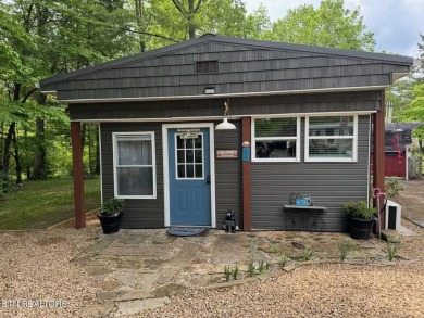 This lovely home on a one and a half lot provides ample privacy on Lake Tansi Village Country Club in Tennessee - for sale on GolfHomes.com, golf home, golf lot