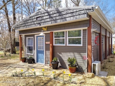 This lovely home on a one and a half lot provides ample privacy on Lake Tansi Village Country Club in Tennessee - for sale on GolfHomes.com, golf home, golf lot