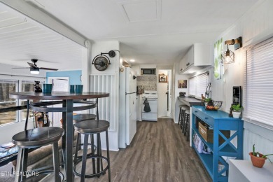 This lovely home on a one and a half lot provides ample privacy on Lake Tansi Village Country Club in Tennessee - for sale on GolfHomes.com, golf home, golf lot