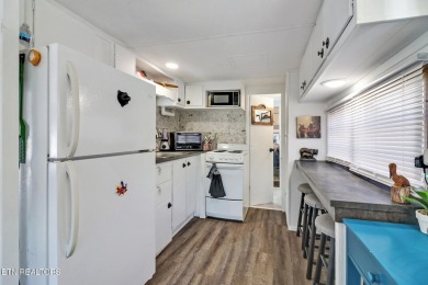 This lovely home on a one and a half lot provides ample privacy on Lake Tansi Village Country Club in Tennessee - for sale on GolfHomes.com, golf home, golf lot