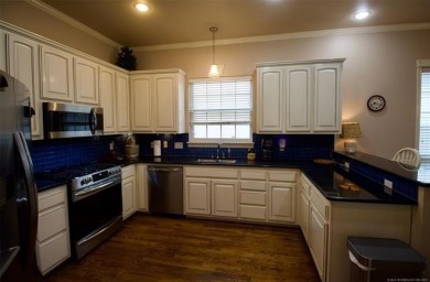 Located in the gated Magnolia Gardens community at Battle Creek on Battle Creek Golf Course in Oklahoma - for sale on GolfHomes.com, golf home, golf lot