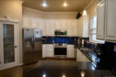 Located in the gated Magnolia Gardens community at Battle Creek on Battle Creek Golf Course in Oklahoma - for sale on GolfHomes.com, golf home, golf lot