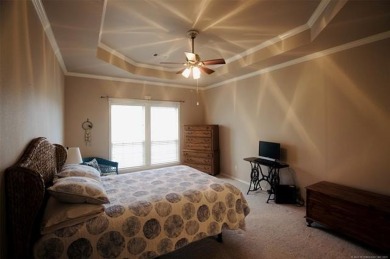 Located in the gated Magnolia Gardens community at Battle Creek on Battle Creek Golf Course in Oklahoma - for sale on GolfHomes.com, golf home, golf lot